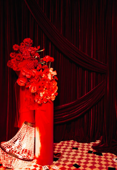 Playful drape backdrop with floral and props