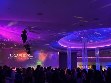 L'Oréal brand activation event with cosmic lighting design, projection, party