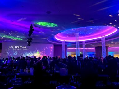 Cosmic imagery experiential event with upscale décor, lighting, and projection mapping